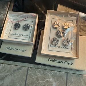 Coldwater Creek button covers Wolf head and Paw Print